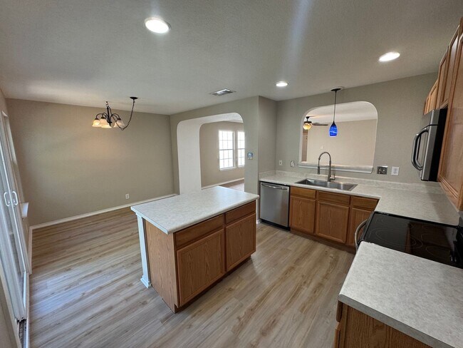 Building Photo - NEW PAINT, FLOORING, APPLIANCES & ROOF  | ...