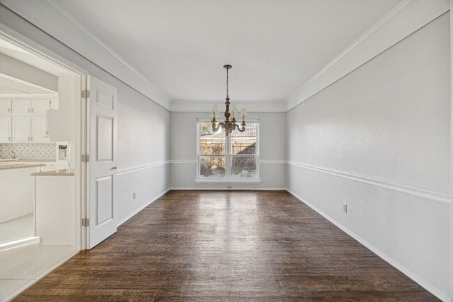 Building Photo - "Spacious 4-Bedroom, 2.5-Bath Living Meets Storybook Backyard Charm!"