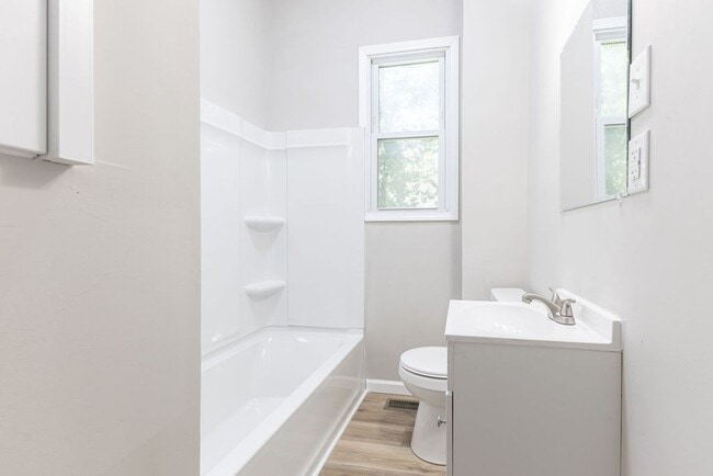 Building Photo - Remodeled 2-Bedroom Bungalow with Spacious Yard & 1-Car Basement Garage