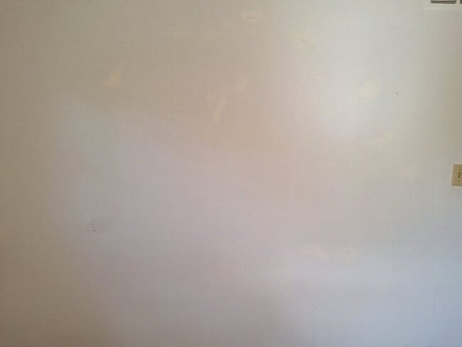 Building Photo - Cute white cottage with white picket fence & Huge deck off back door!