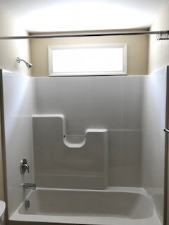 Shower/tub combo unit with space for your bath accessories - 2312-A Belle Ave NE