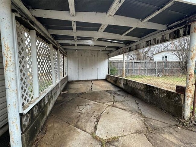 Building Photo - Three bedroom two bath home with central heat and air, large fenced backyard, and carport!