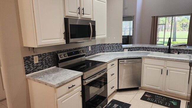 Building Photo - 3 BR 2.5 BA 1 CG rental in secure gated To...