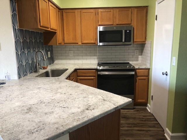 White granite counter tops and stainless steel appliance - 2450 Wickersham Ln