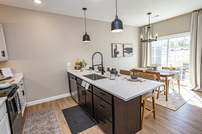 Breakfast bar with trendy pendant lighting, a dishwasher and industrial sink - 110 Sierra Cir