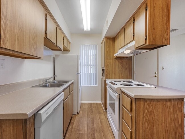 Kitchen with White Appliances - Glen Oaks Apartments