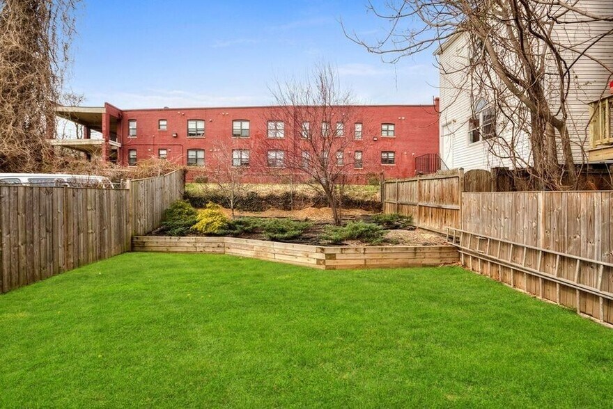 Shared backyard perfect for morning coffees and evening BBQs! - 2576 Sherman Ave NW
