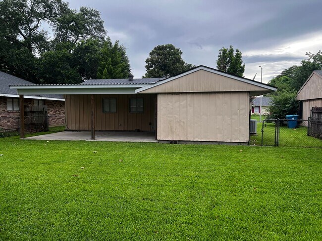 Building Photo - 3 Bedroom, 1.5 Bathroom, Brick Home with yard and Storage Building, Covered Porch