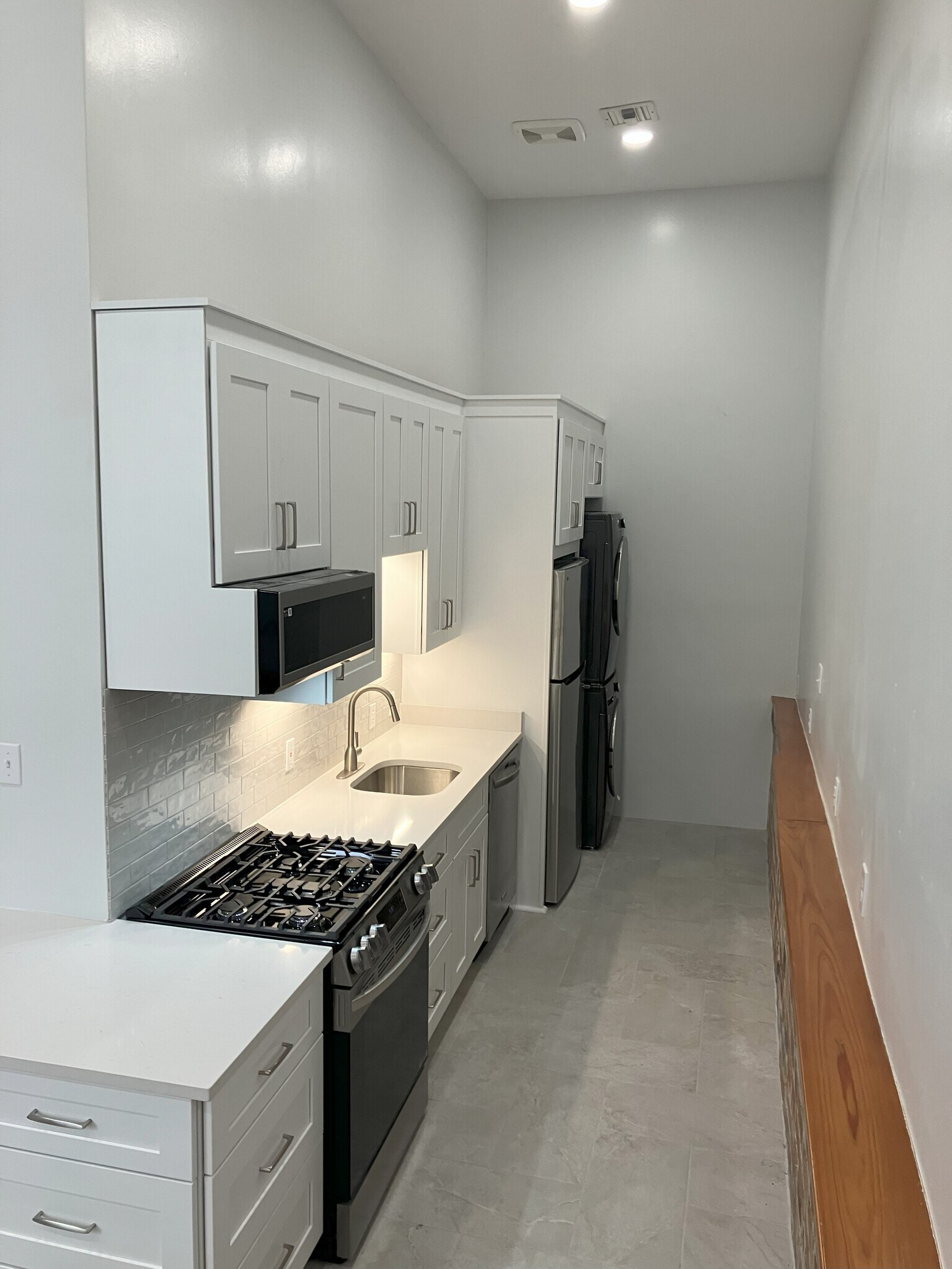 Washer and dryer at end of room - 2039 Valence St