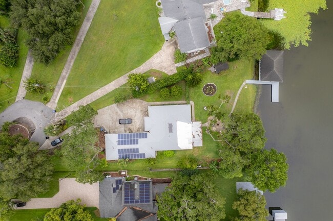 Building Photo - Lake Jessamine Luxury: Solar-Powered Waterfront Retreat on 1.14 Acres with Dock & Boathouse