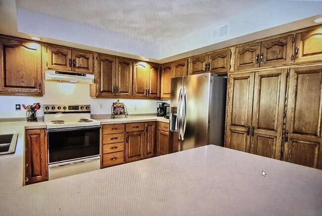 Wood cabinet and pantry for ample storage - 808 Pony Ln