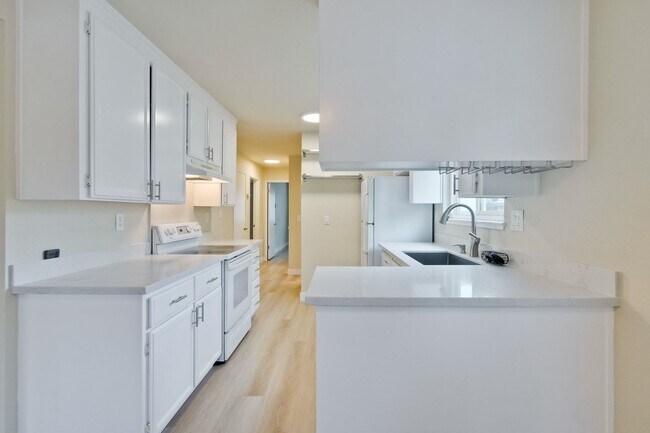 Building Photo - Refreshed 2/2 Second Floor Campbell Condominium in Great Location! Attached Garage & Additional S...