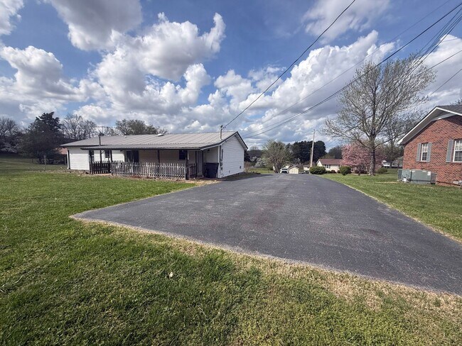 Building Photo - Spacious 3-Bedroom Home with Huge Yard, Covered Porches & Storage Building