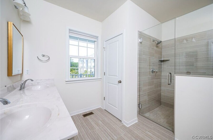 Primary bathroom with water closet and walk in shower - 2008 Libbie Lake West St
