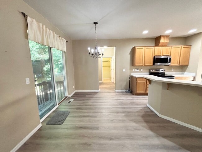 Building Photo - Stunning Remodeled Home with Office, A/C, Fenced Yard & Flexible Living Space!