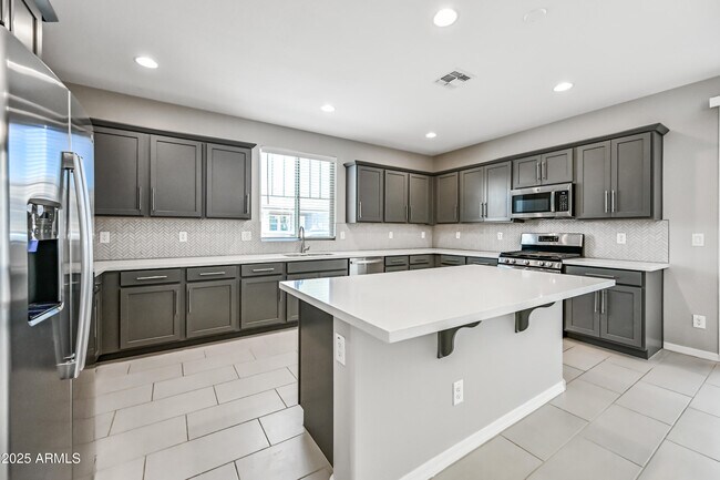 Building Photo - 3817 N 100th Dr