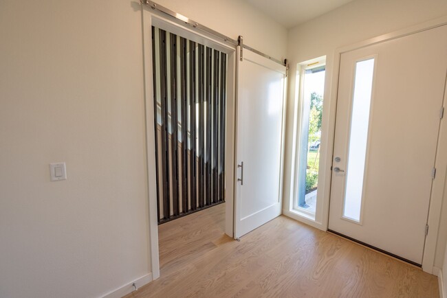 Building Photo - Riverside Townhomes - Waterfront Living in...