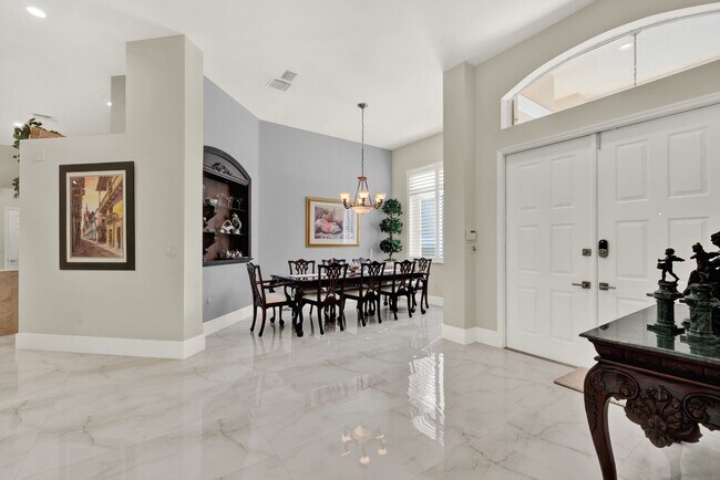 Building Photo - Elegant 4-Bedroom Pool Home in Exclusive G...
