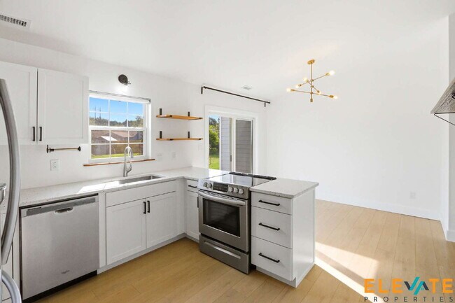 Building Photo - Beautiful Like-New 3 Bedroom Home with Huge Fenced Yard, Greenhouse & Storage