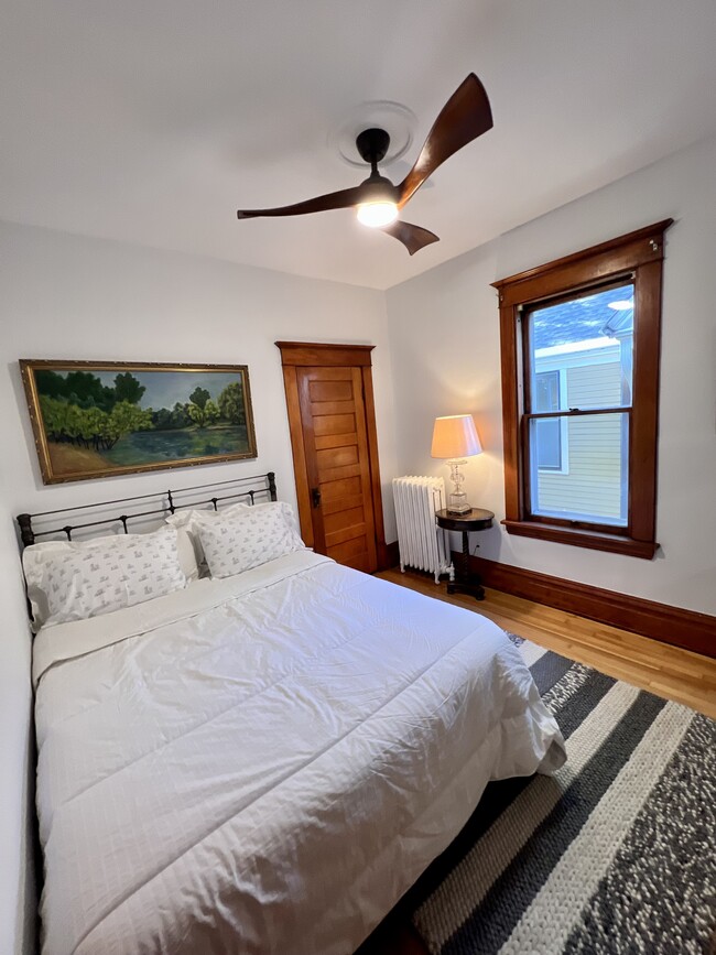 Middle bedroom with new queen bed and walk in closet. - 2424 Stevens Ave