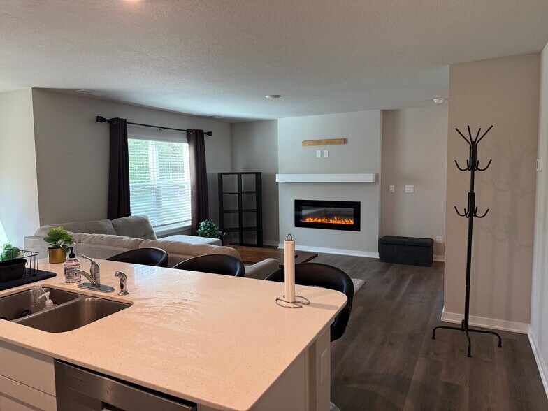 Living room, with fireplace - 4521 SE Ember Ln