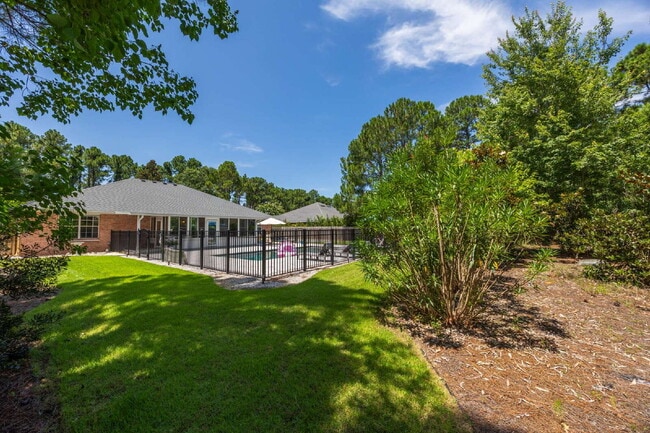 Building Photo - "Coastal Elegance Awaits: Spacious 4-Bed Oasis with $400.00 Off First Full Months Rent!"