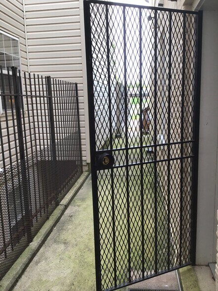 Security gate in rear from small bedroom - 1425 5th St NW