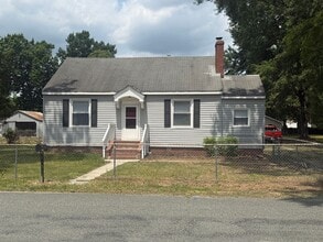 Building Photo - 2-bedroom 1 bathroom Cottage on a large lot with 2 large storage building on site