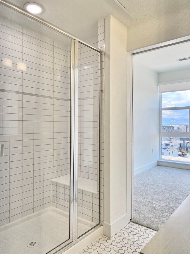 Building Photo - Luxury Top-Floor Condo with Stunning Mountain & City Views