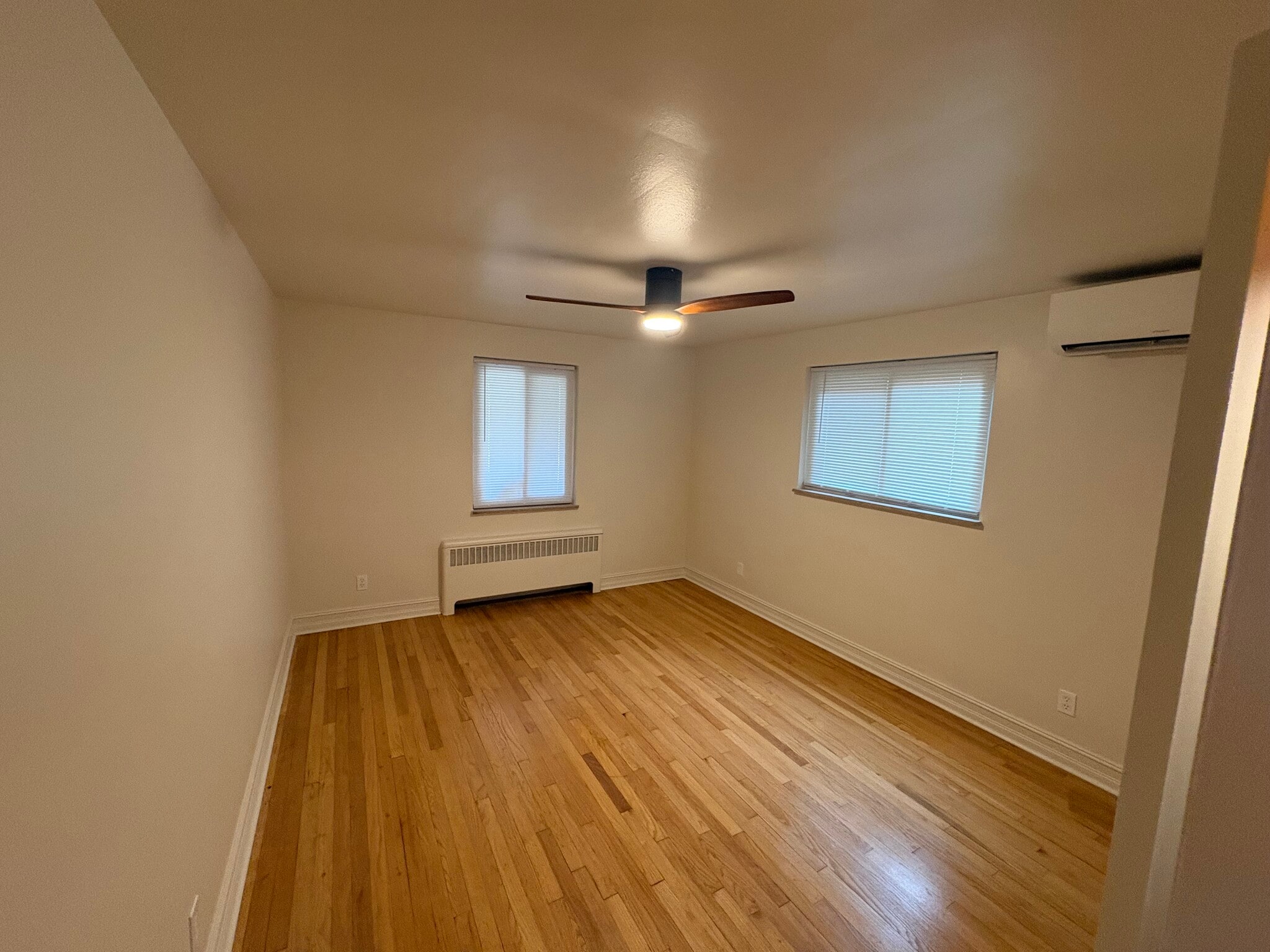 Primary bedroom with mini-split heating and cooling - 6035 Oakwood Ave
