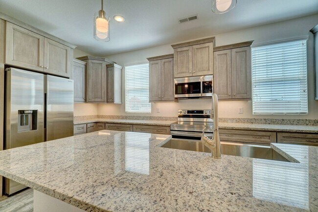 Building Photo - Available 08-05-25! Coastal Luxury Townhom...