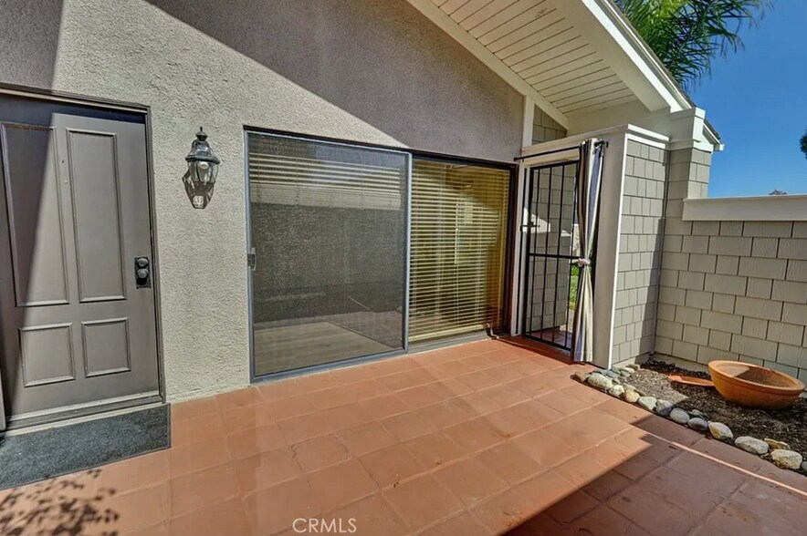 Entry courtyard is gated, fenced spacious and private. - 8566 Larkhall Cir