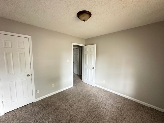 Building Photo - MOVE-IN READY! 3BR/2BA in Quiet Cove | Brick Fireplace | Fenced Yard & Patio!