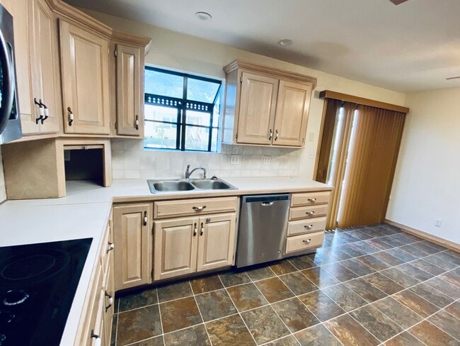 Building Photo - {5639} Spacious Ranch + Two Separate Living Quarters + Fenced Yard!