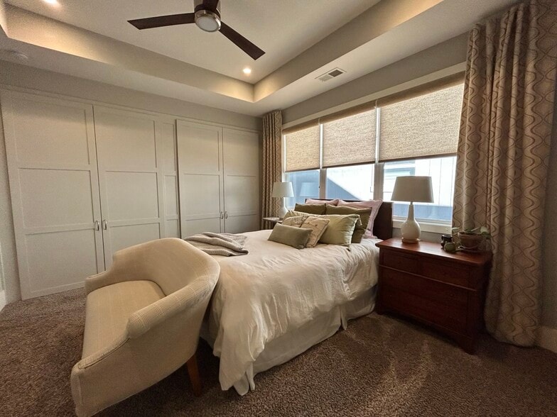 Primary bedroom with ensuite bathroom and separate his and her closets - 405 E 32nd Ave