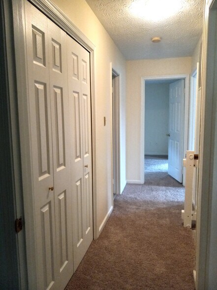 Upstairs hallway with large linen closet - 6146 Franconia Station Ln