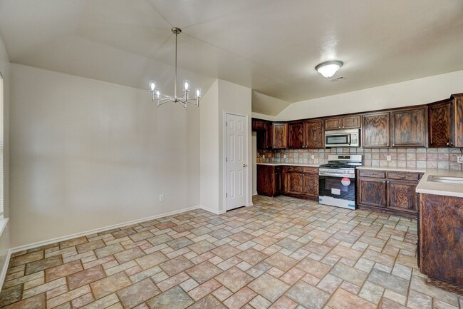 Building Photo - Spacious 4-Bedroom Home with Corner Firepl...