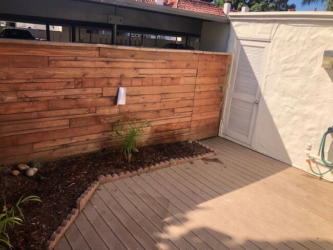 Building Photo - Beautiful Townhome with large fenced back patio, second story balcony, and two covered parking spots