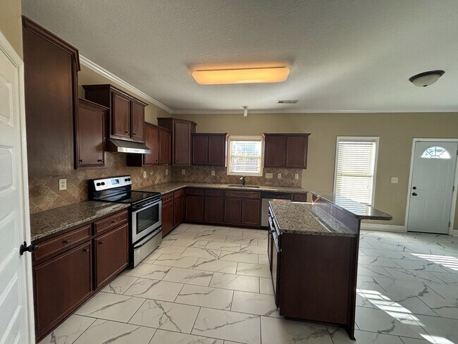 Building Photo - This property blends ample living space and storage with functional amenities.