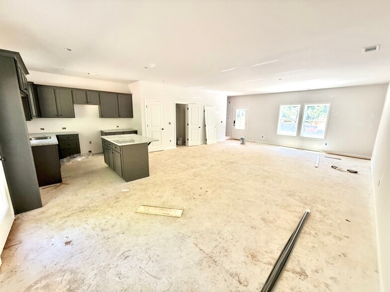 View of first floor. Open concept kitchen, dining room and living room. - Stephens Court