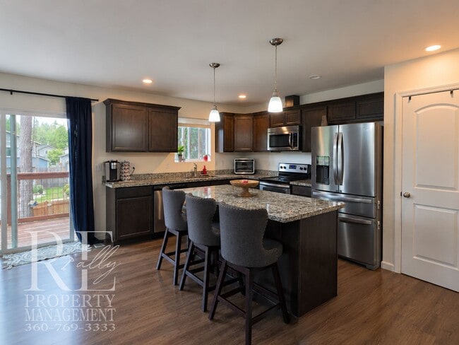 Building Photo - Spacious 3-Story Home with Flexible Living Space, Heat Pump & Private Deck Retreat