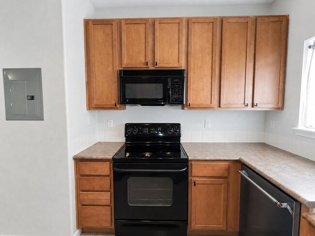 Building Photo - Spacious 2-Bedroom Condo with Garage, Fireplace, Pool & Most Included Utilities