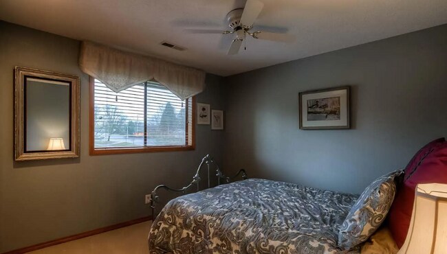 Building Photo - 4bd/3ba HUGE Home w/Hardwood Floors, Russian Fireplace, 2-Car Garage & Fenced Back Yard!