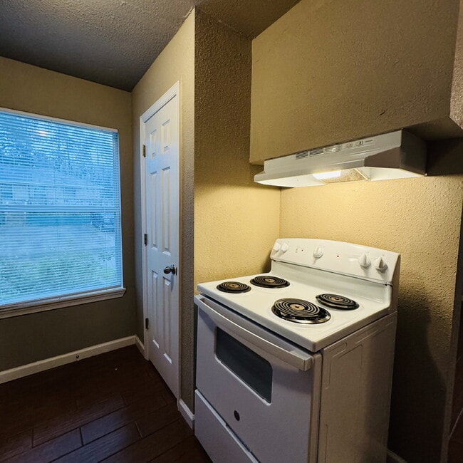 Building Photo - Welcome to Pine Shadows Duplex Apartment