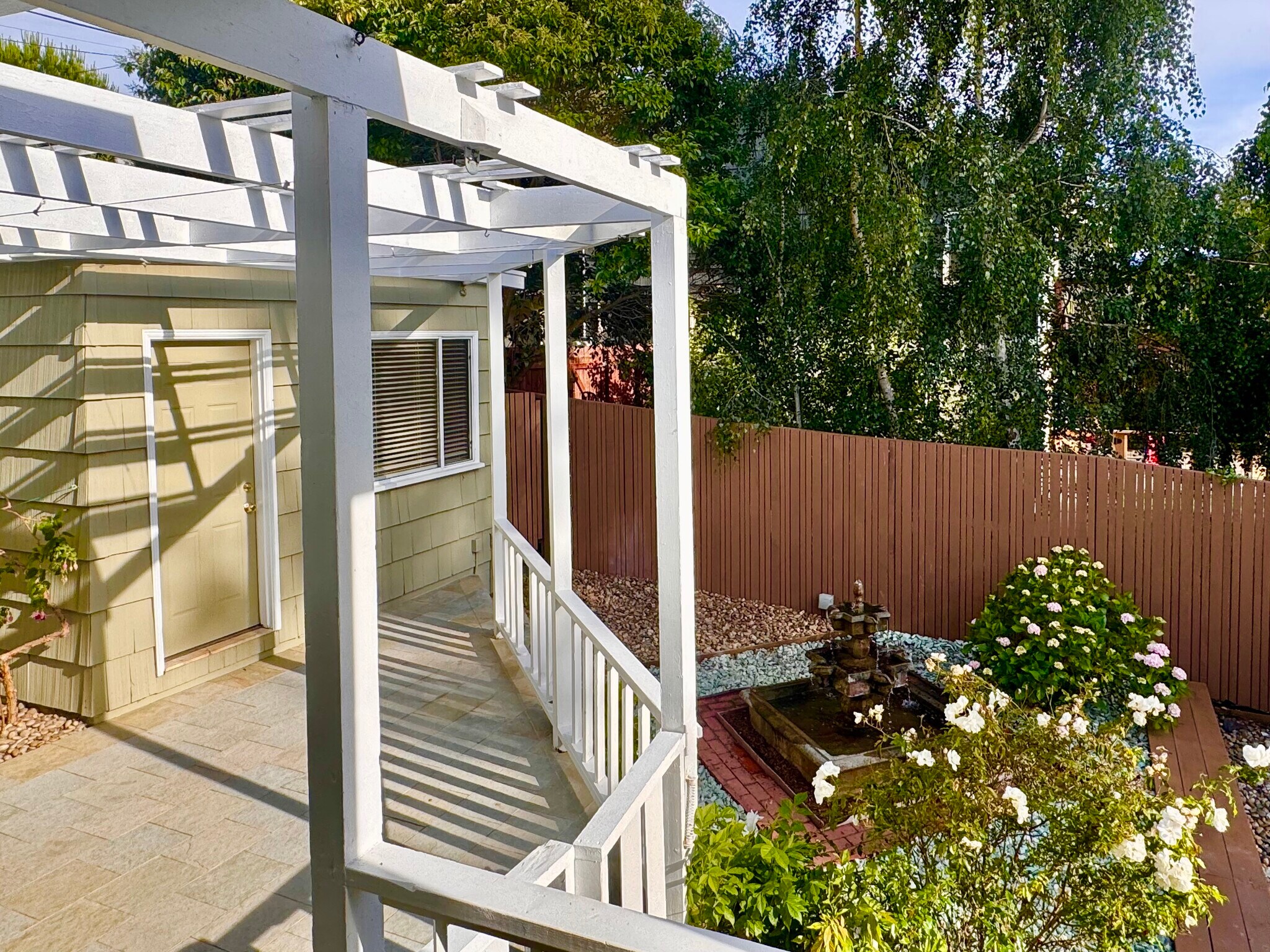 The pleasant splashing sounds of the large Spanish fountain, roses, hydrangas and mature white birch - 2403 Mira Vista Dr
