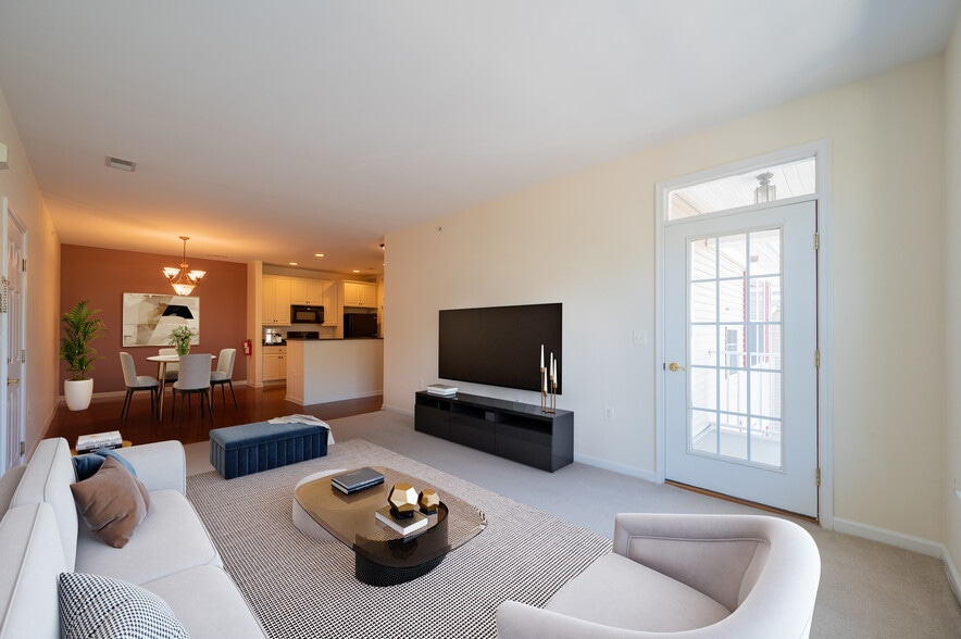 Open living room with door to the private balcony - 539 Sophee Ln