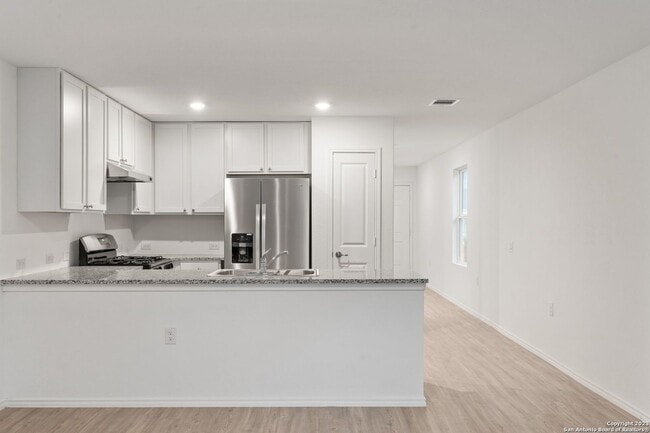 Building Photo - This beautiful single-story home has 4 bedrooms, 2 baths, vinyl flooring throughout, an open floo...