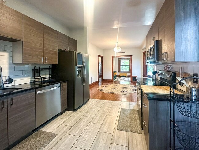 Building Photo - A home where old-world charm meets modern sophistication!