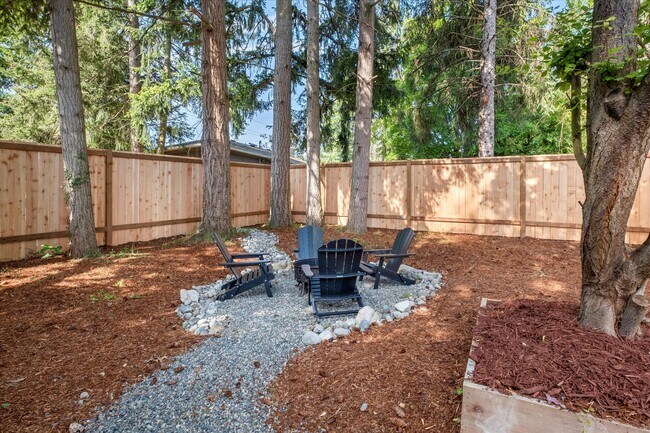An outdoor lounging area with incredible privacy to experience the calm of Tacoma's north end. - 4206 N Winnifred St