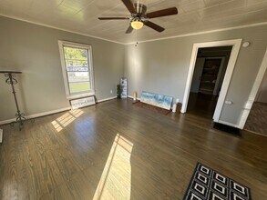 Building Photo - 2 Bed House w/ Wooden floors, Large Front porch, Central HVAC & Huge yard!